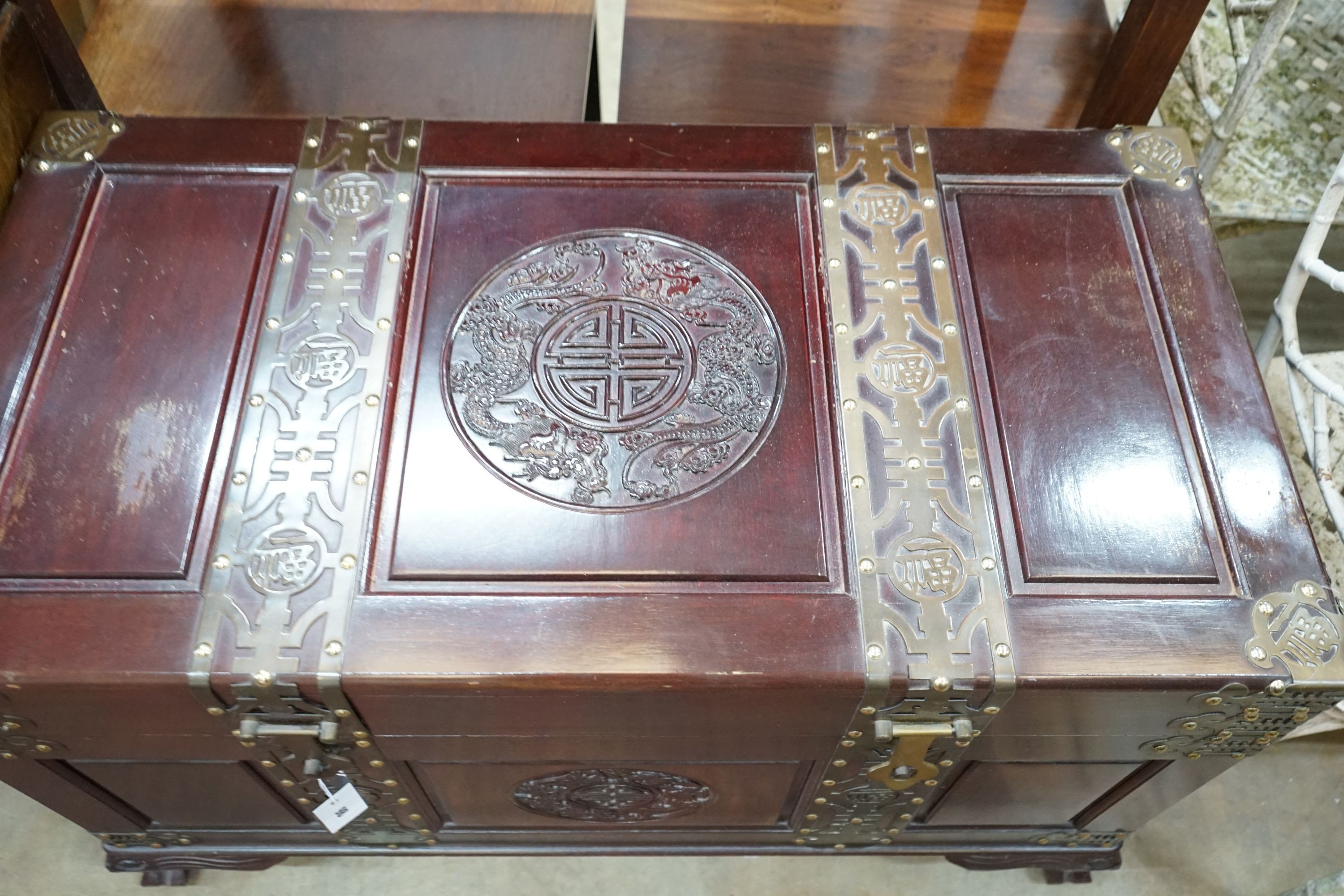 A Chinese brass mounted carved hardwood coffer, length 102cm, depth 52cm, height 63cm